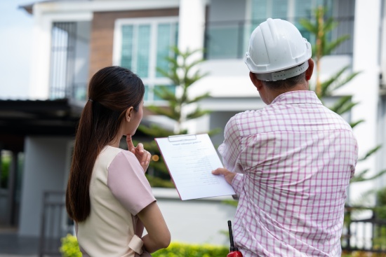 Senior home inspector explains Inspection results with homeowner, handyman holding clipboard and after checking details before renovations home, house improvement interior, Interior design Real estate