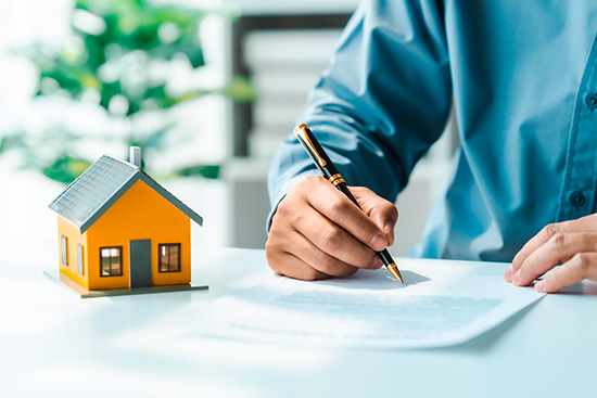 Person writing at paper a home planning. 